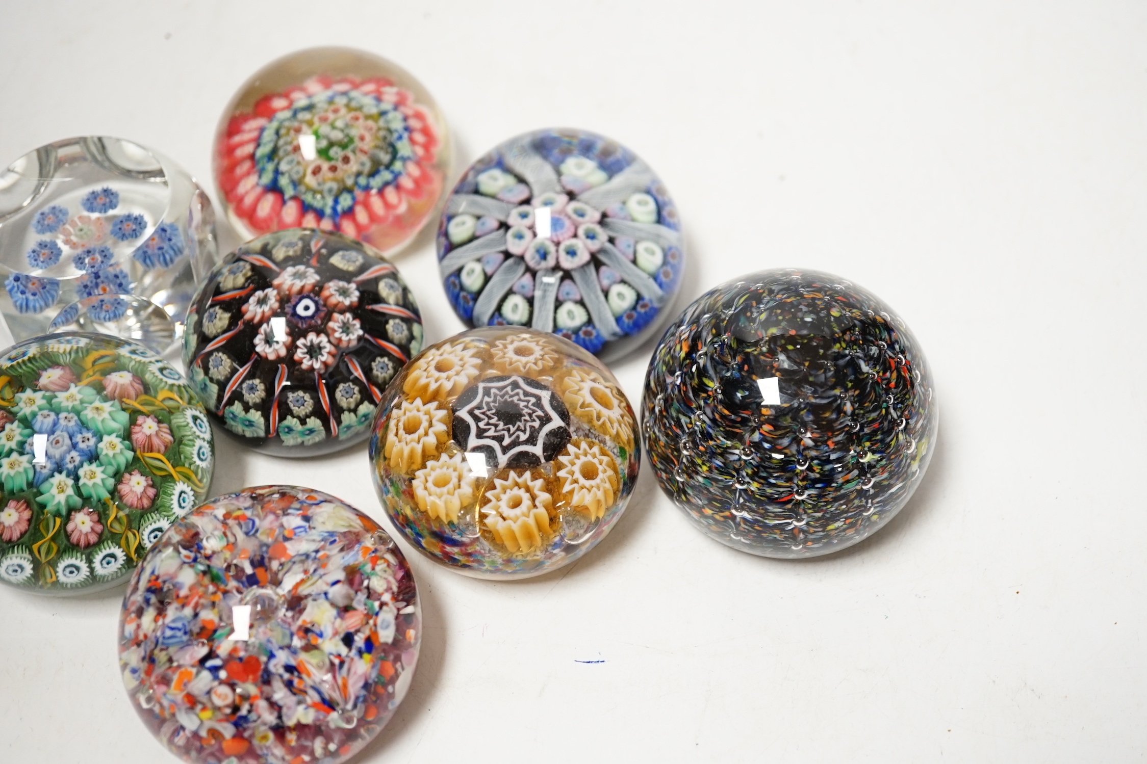 Eight millefiori or scrambled glass paperweights including Strathearn, largest 6cm in diameter
